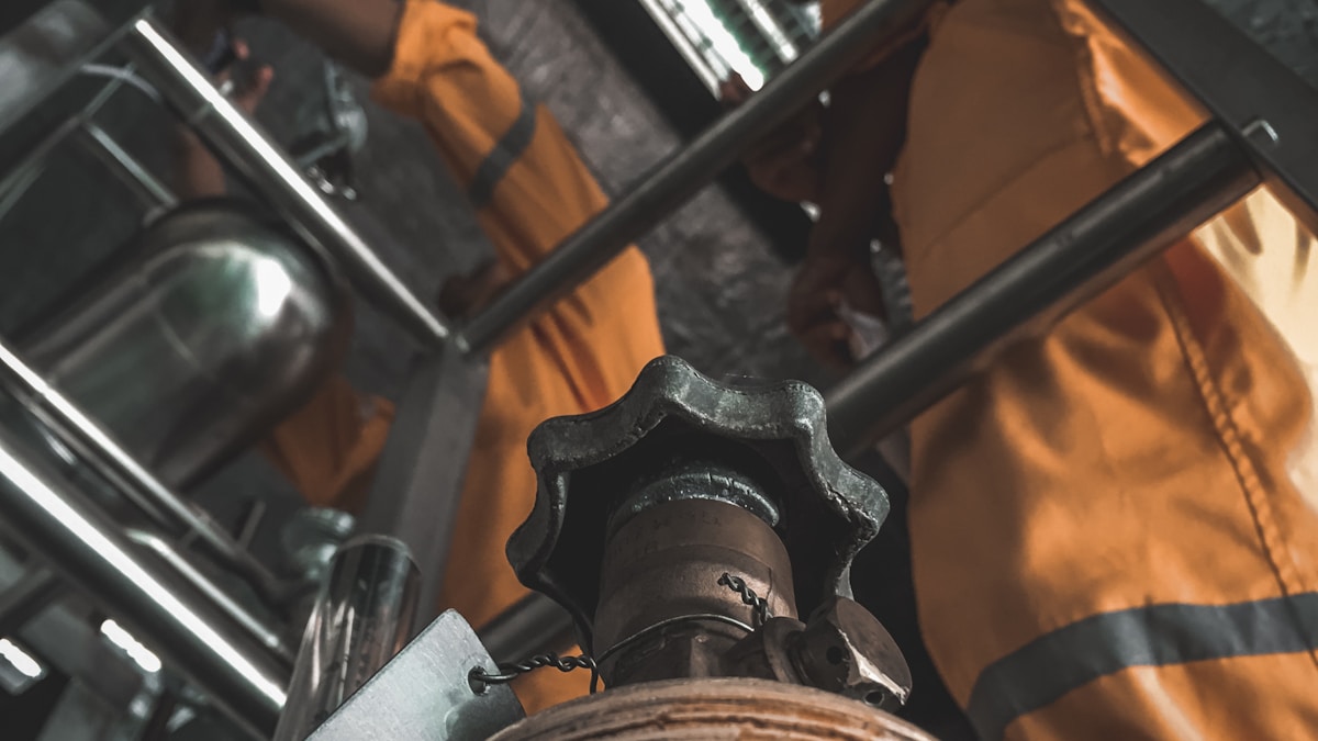 Plant pipework and an engineer at work